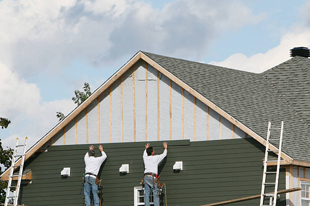 Professional Storm Damage Siding Repair technician working in Huntingtown, MD